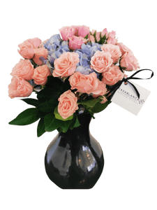 Jarrón de mini rosas rosas