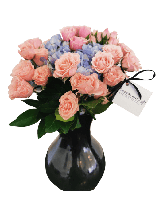 Jarrón de mini rosas rosas