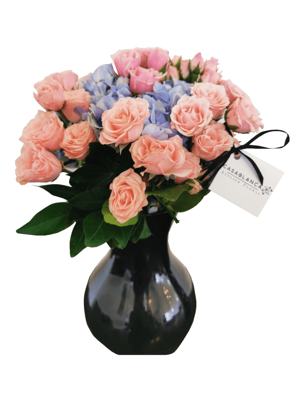 Jarrón de mini rosas rosas